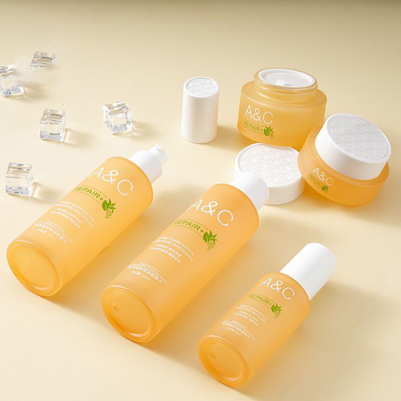 Orange glass round bottle skincare packaging