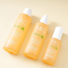 Orange glass round bottle skincare packaging