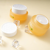 Orange glass round bottle skincare packaging