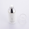 white glass bottle with silver cap